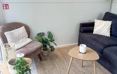 a living room with a couch and a chair and a table at Blackbeard in Almere