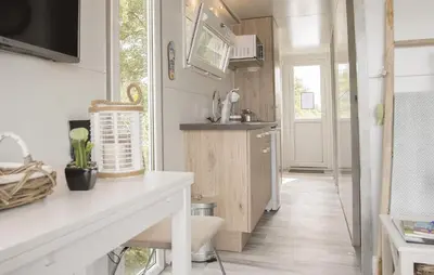 a kitchen with a counter and a sink in a room at Barbossa in Almere