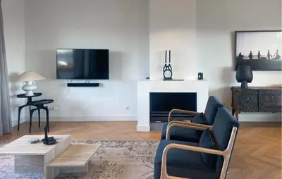 a living room with a fireplace and a tv at Beautiful Home In Loosdrecht With Wifi in Loosdrecht