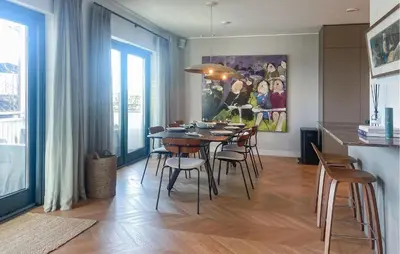 a kitchen and dining room with a table and chairs at Beautiful Home In Loosdrecht With Wifi in Loosdrecht