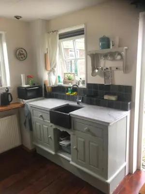 a kitchen with a sink and a counter at Appartement in schuur in Twisk