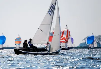 a group of sailboats on a body of water at Heerlijke Houseboat 
