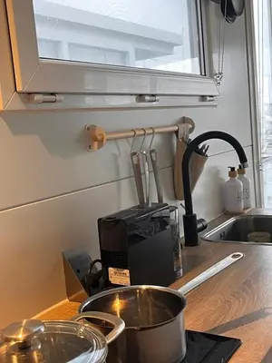 a kitchen counter top with a sink and a sink at Houseboat Oslo perfect voor bezoek Amsterdam in Monnickendam