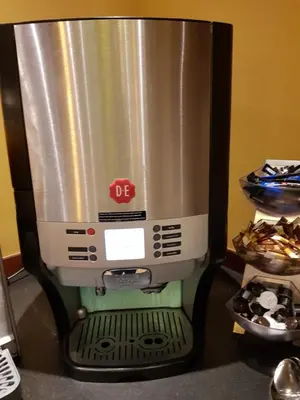 a coffee maker with a silver at Hotel Zee en Duin in Katwijk