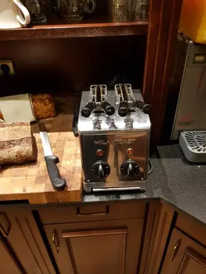a stove top oven sitting on top of a kitchen counter at Hotel Zee en Duin in Katwijk