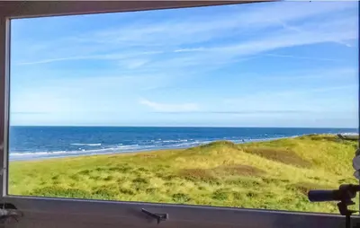 a view of the ocean from a window at JulianaDuin in Bergen aan Zee