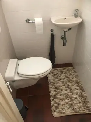 a bathroom with a toilet and a sink at Appartement voor twee personen in Twisk