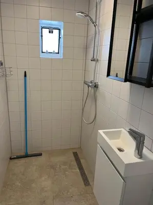 a bathroom with a shower and a sink at Stadscentrum, rustige toplocatie! in Amersfoort