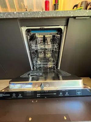 a dishwasher with its door open on top of it at Amsterdam Beach House in Zandvoort