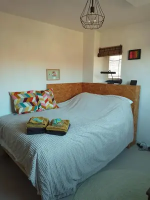 a bedroom with a bed with two towels on it at Kraaipan B&B in Amsterdam