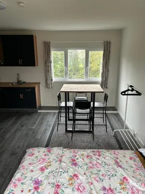 a bedroom with a table and chairs and a bed at Private Apt Amsterdam in Amsterdam