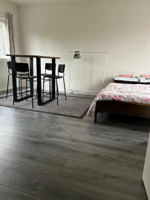 a room with a table and chairs and a bed at Private Apt Amsterdam in Amsterdam