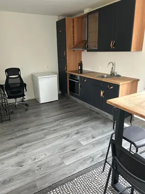 an empty kitchen with a sink and a table and chairs at Private Apt Amsterdam in Amsterdam