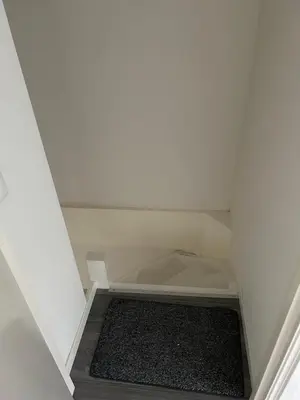 a drawer in a corner of a room at Private Apt Amsterdam in Amsterdam