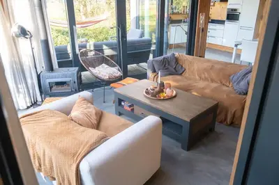 a living room with two couches and a coffee table at Dunes of Egmond in Egmond-Binnen