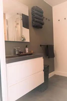 a bathroom with a sink and a mirror at Dunes of Egmond in Egmond-Binnen