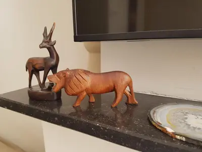 a figurine of a fox and a deer on a counter at The Fabulous Suite in Amsterdam