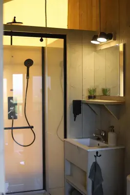 a bathroom with a shower and a sink at Safari Lodges XL in Nieuwe Wetering