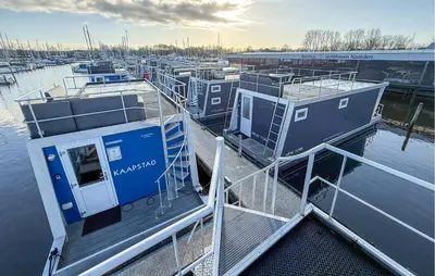 a group of boats docked at a marina at Johannesburg in Naarden