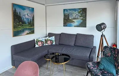 a living room with a couch and a table at 2 Bedroom Amazing Ship In Naarden in Naarden