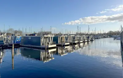 a group of boats docked in a marina at Stellenbosch in Naarden