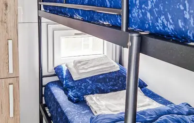 a couple of bunk beds in a room at New York in Naarden