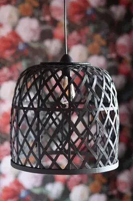 a black light fixture hanging from a ceiling at Boutique Hotel Noordeinde in Rijnsburg