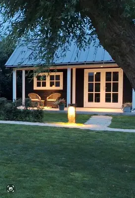 a house with a light in the front yard at Park De Driesprong in Nieuwveen