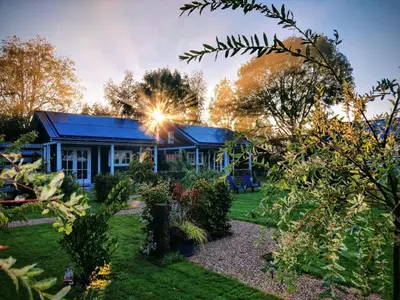 a house with a garden in front of it at Park De Driesprong in Nieuwveen