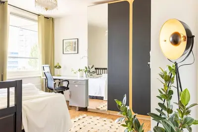 a bedroom with a mirror and a bed and a desk at My Apartment on the Water in Amsterdam