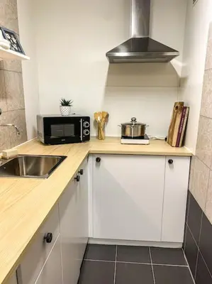 a kitchen counter with a microwave and a sink at My Apartment on the Water in Amsterdam