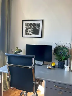 a blue desk with a computer on top of it at My Apartment on the Water in Amsterdam