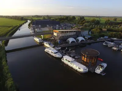 an aerial view of boats docked in a marina at Design huisje vrij in het groen in IJsselstein