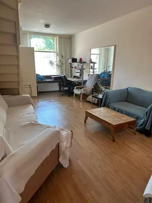 a living room with a couch and a coffee table at Terraced Bedroom in Utrecht