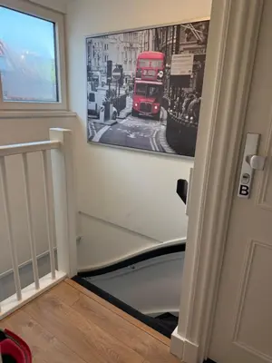 a hallway with a picture of a double decker bus on the wall at Tante Bed 44A in Voorschoten