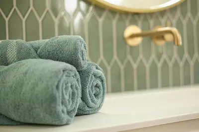 a towel on a counter in a bathroom at The Stork - In luxe logeren aan de Oudegracht, Centrum Utrecht in Utrecht