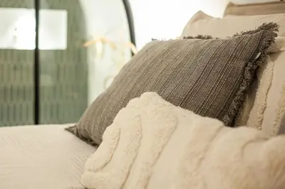 a close up of a bed with a pillow at The Stork - In luxe logeren aan de Oudegracht, Centrum Utrecht in Utrecht