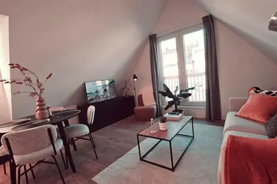 a living room with a couch and a table at Tante Bed 44 B in Voorschoten