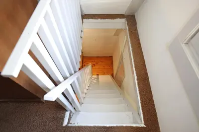 a stair case in a house with a box at Dok Apartments in Amsterdam