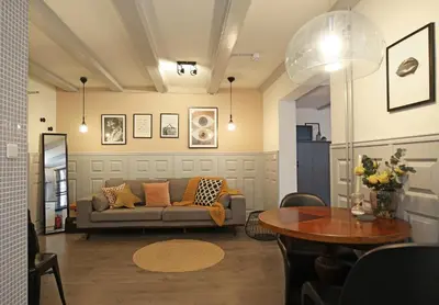 a living room with a couch and a table at Dok Apartments in Amsterdam
