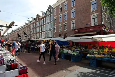 a group of people walking around an outdoor market at Spacious Suite at Park and Museum in Amsterdam