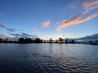 a view of a large body of water at sunset at Dobberhuisje in IJsselstein