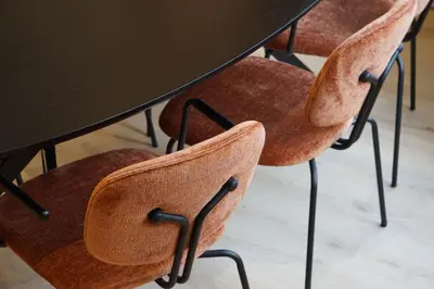 a table with four chairs around a table at Zen Beach Apartment in Noordwijk aan Zee