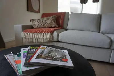a living room with a coffee table and a couch at Zen Beach Apartment in Noordwijk aan Zee