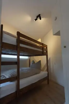 a couple of bunk beds in a room at Zen Beach Apartment in Noordwijk aan Zee