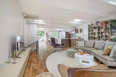 a living room with a couch and a table at The Elegant Amsterdam Apartment in Amsterdam