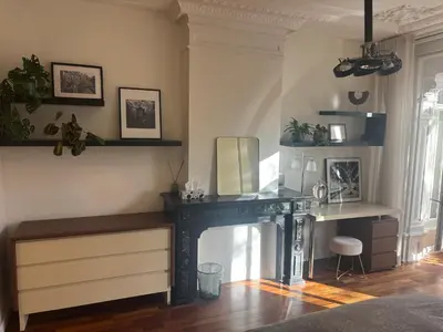 a room with a desk and a table with a mirror at The Elegant Amsterdam Apartment in Amsterdam