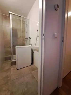 a bathroom with a shower and a sink and a tub at Apartments, 20 minutes from Amsterdam, Full service objectcode UM46 in Uitgeest