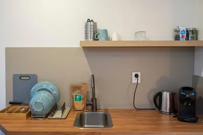 a kitchen counter top with a sink and a counter top at Skua Escape in Zandvoort