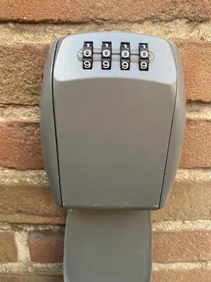 a toilet dispenser is attached to a brick wall at Vakantiehuis de Creutz in Beverwijk